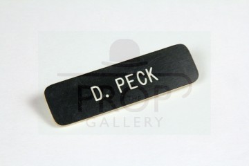 Dennis Peck (Richard Gere) name badge