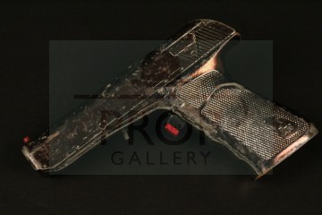 Princess Karina (Mary Crosby) pistol