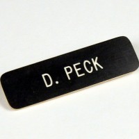 Dennis Peck (Richard Gere) name badge
