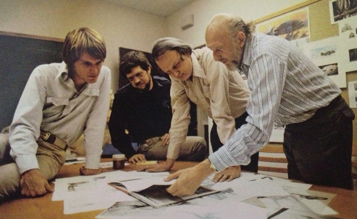 Joe Johnston, Richard Edlund, Dennis Muren & Irvin Kershner review some concept work during the production of Empire Strikes Back